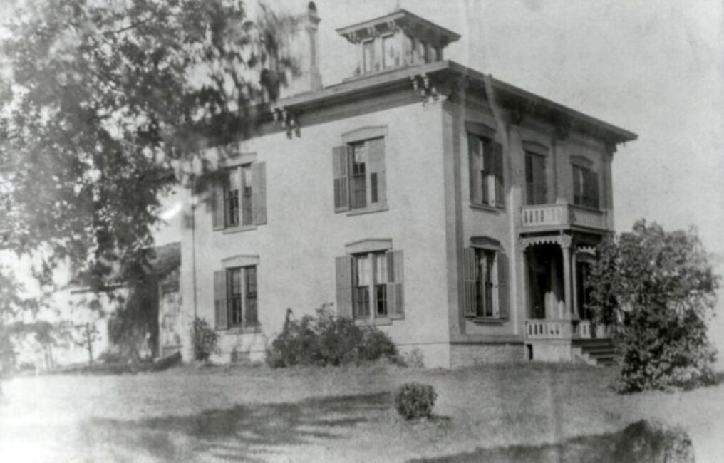 A black and white photo of the Wustum Museum exterior