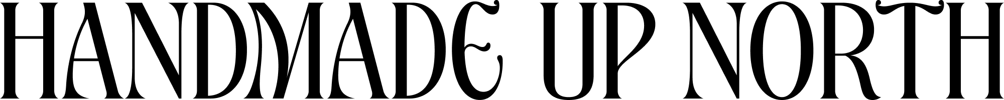 The image displays the phrase “HANDMADE UP NORTH” in large, ornate black lettering on a light background.