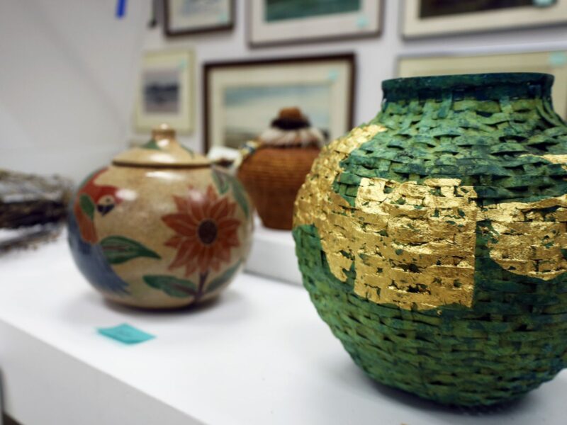 pots sitting on a table for sale at RAM's art sale